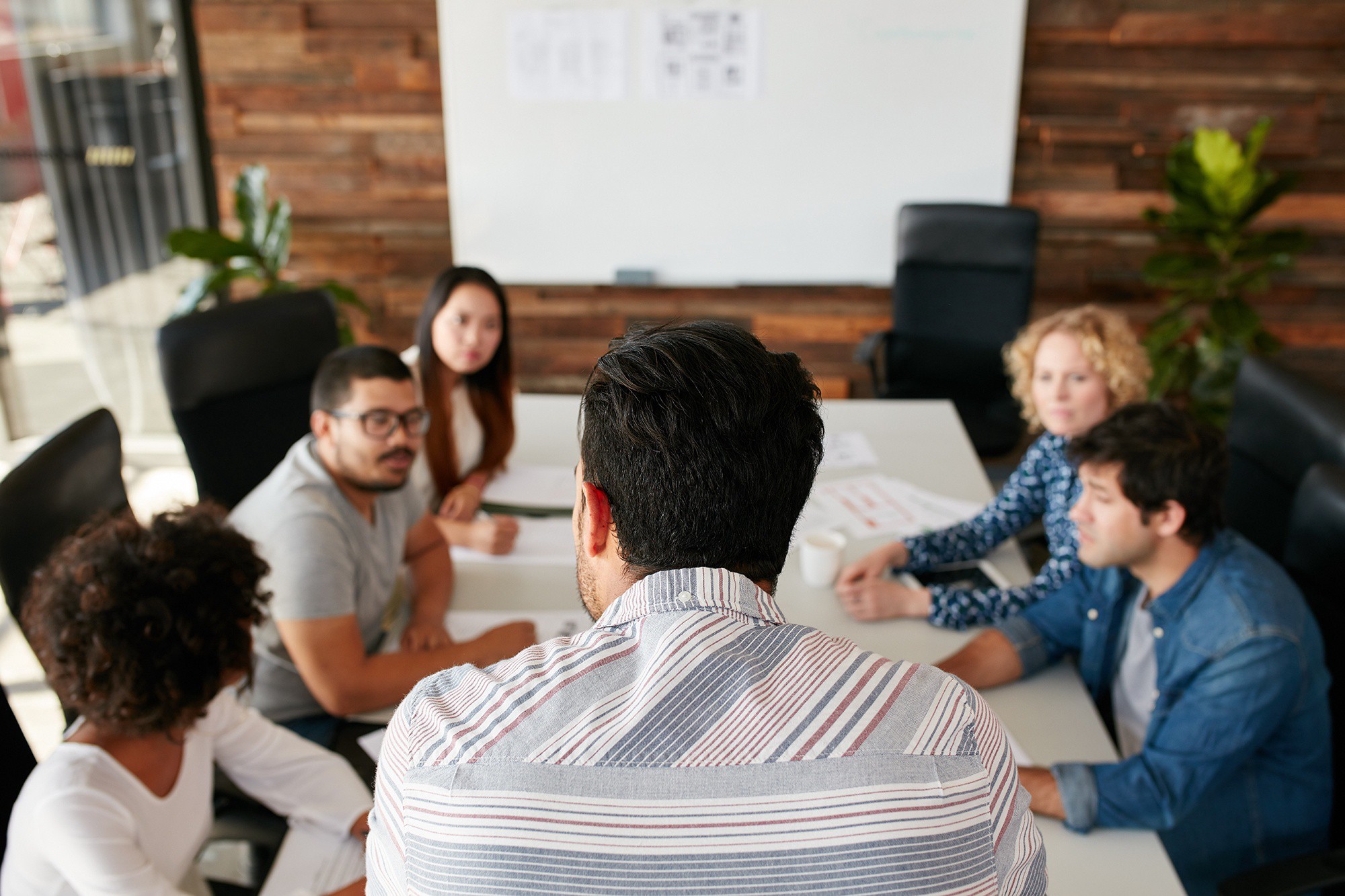 Moderator leading a focus group discussion to gather consumer insights